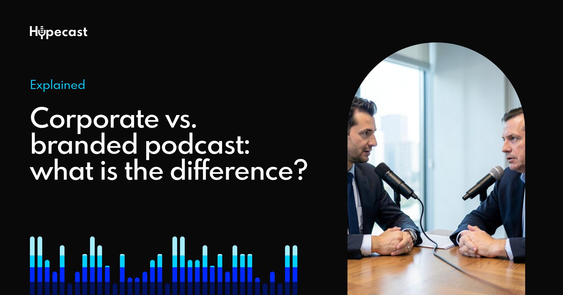 Two colleagues recording a corporate interview podcast at a table with microphones