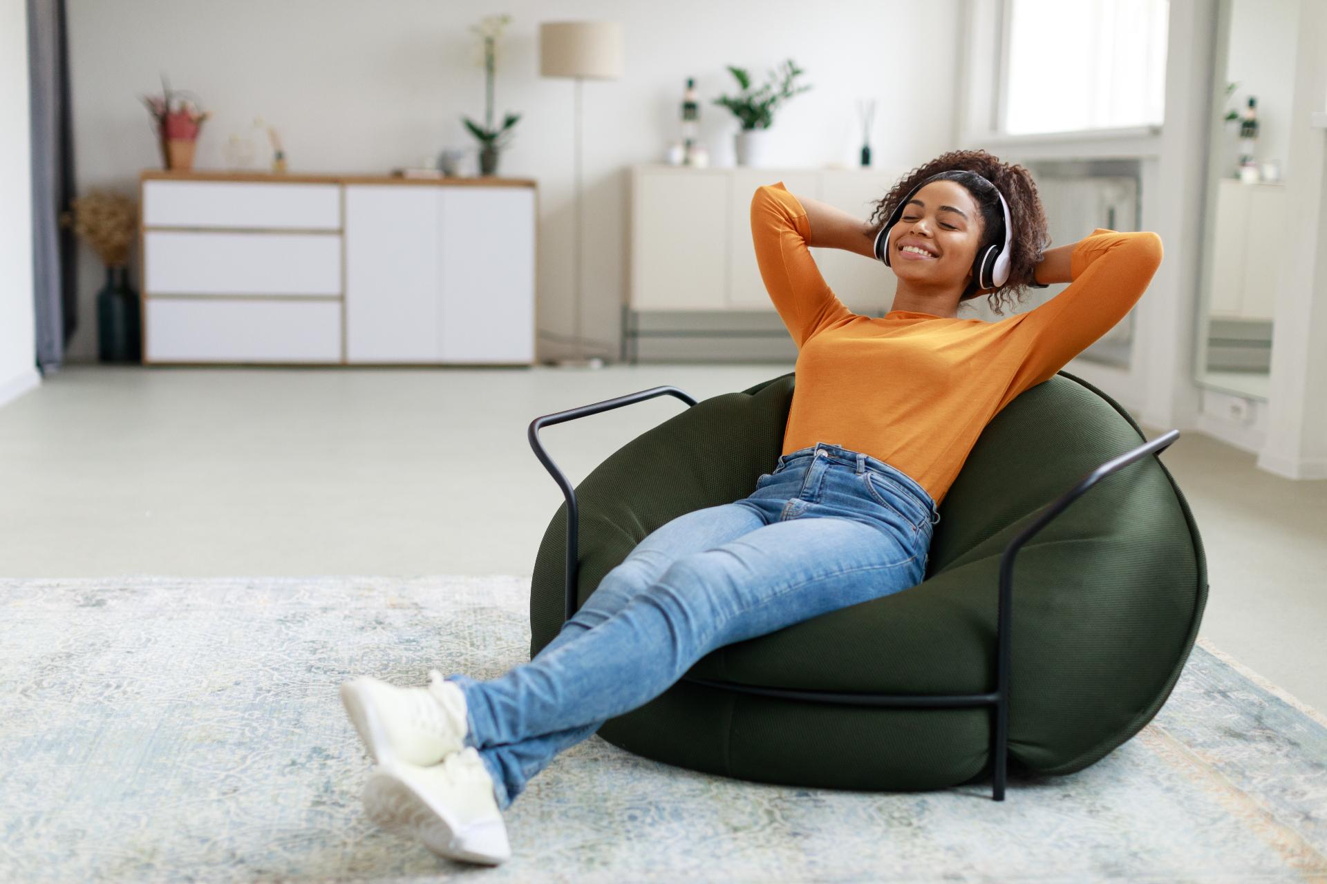 Person relaxing and enjoying audio learning with headphones